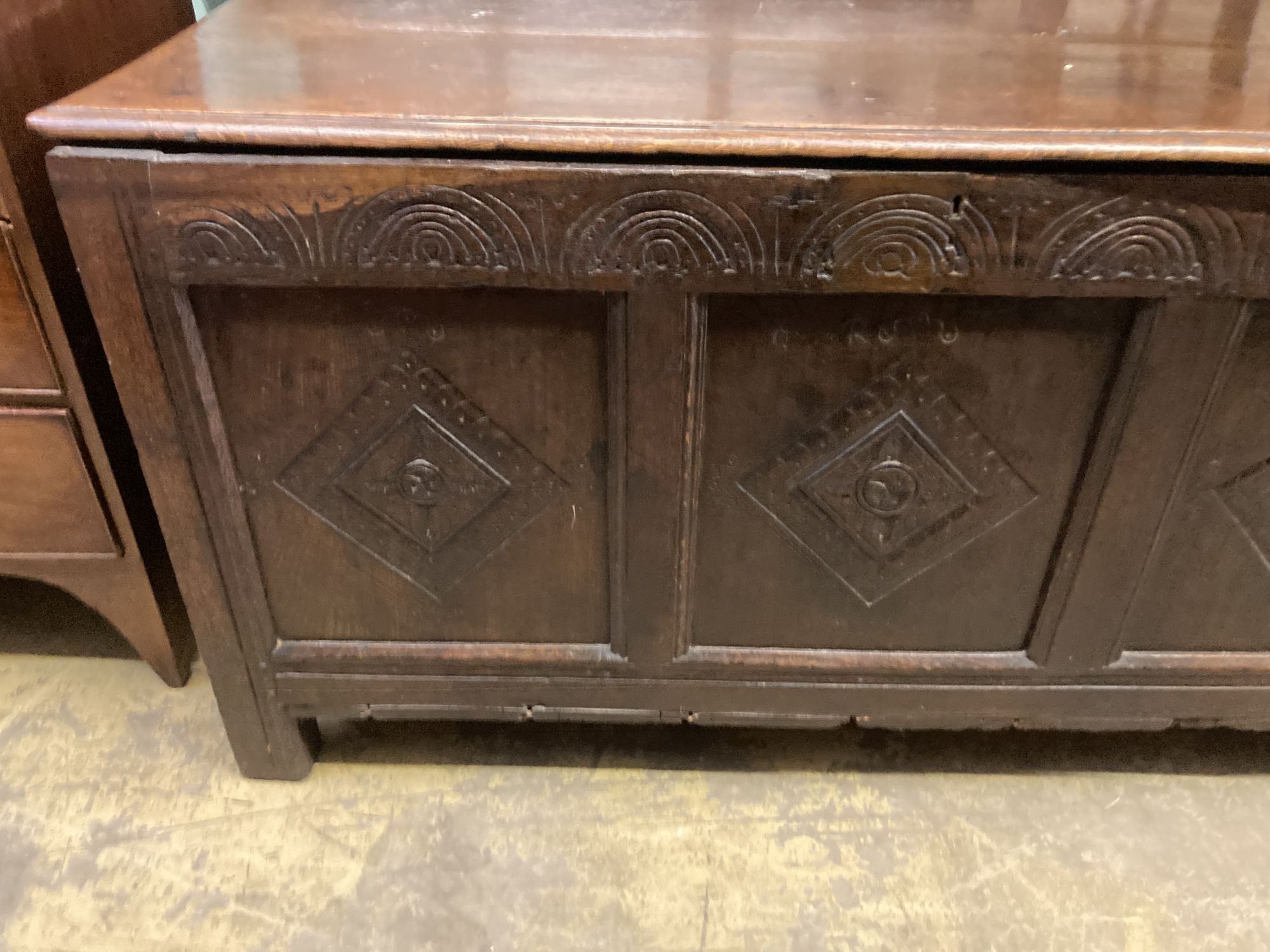 An 18th century carved oak coffer, length 134cm, depth 60cm, height 72cm